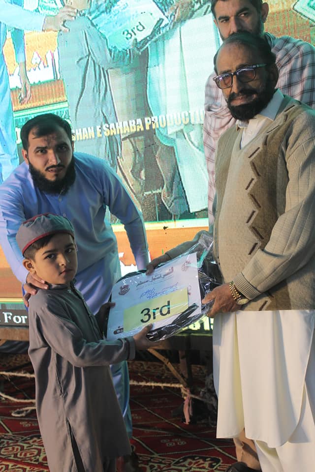 Dog sitting in a yellow kayak